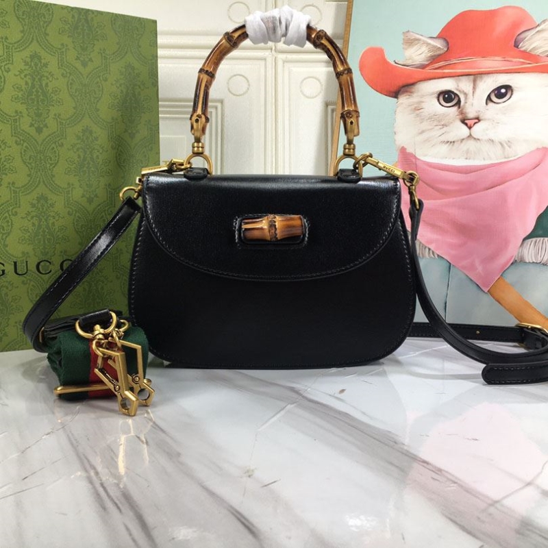G*u*i top handle bags